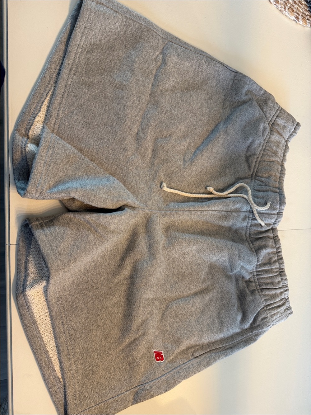New Balance Gray Athletic Shorts with Red Logo